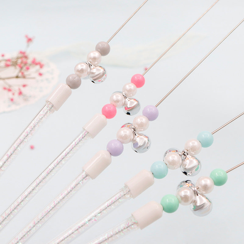Baguette de jeu colorée pour chat avec pompons et grelot